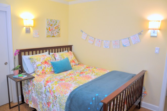 guest room bed and banner after