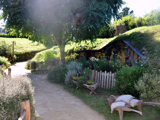 Hobbiton yellow house and wheelbarrow