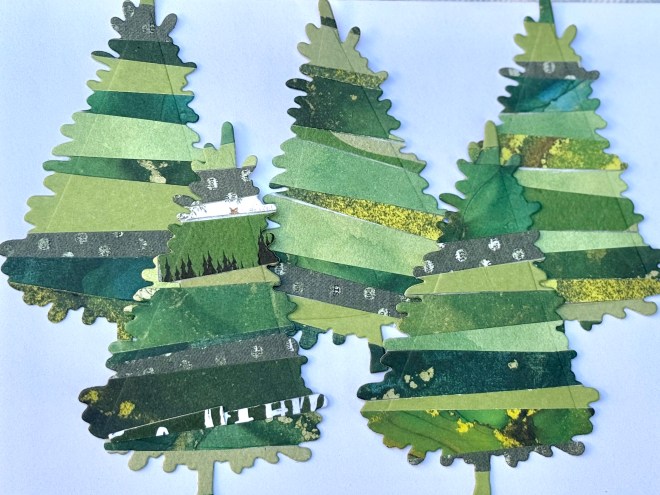 A collection of handmade paper Christmas trees crafted from various shades of green paper strips, arranged on a white background.